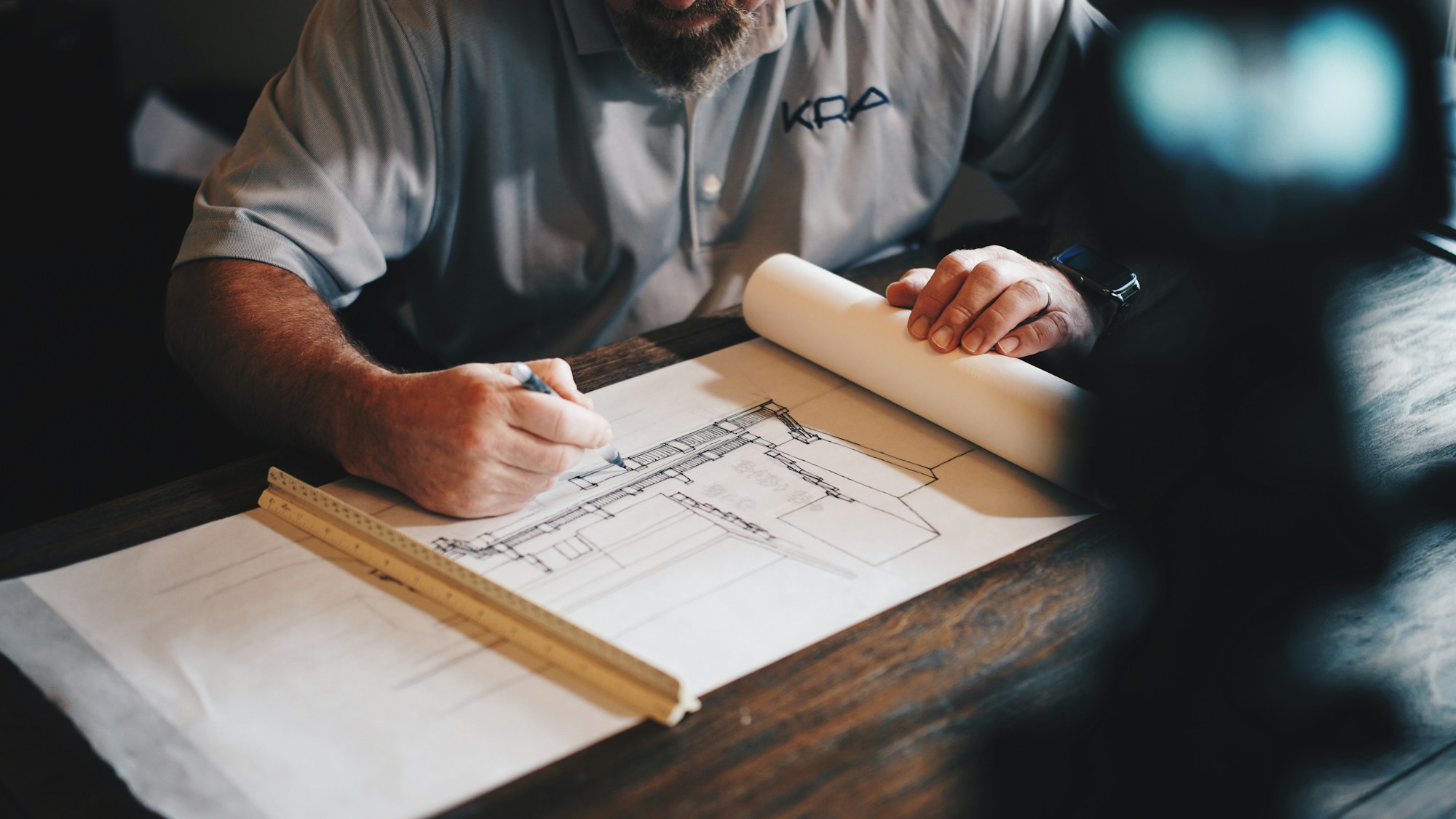 Mechanical engineer reviewing a technical manufacturing drawing